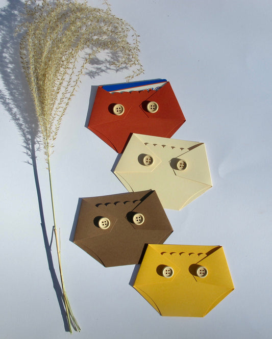 four diaper shaped gift card holders in assorted boho colors