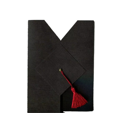 A graduation congratulations card that looks like a black graduation gown with a cap and with a red tassel attached to it.