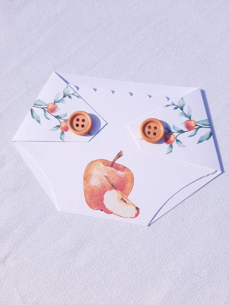 diaper shaped gift card holder with an apple design and buttons