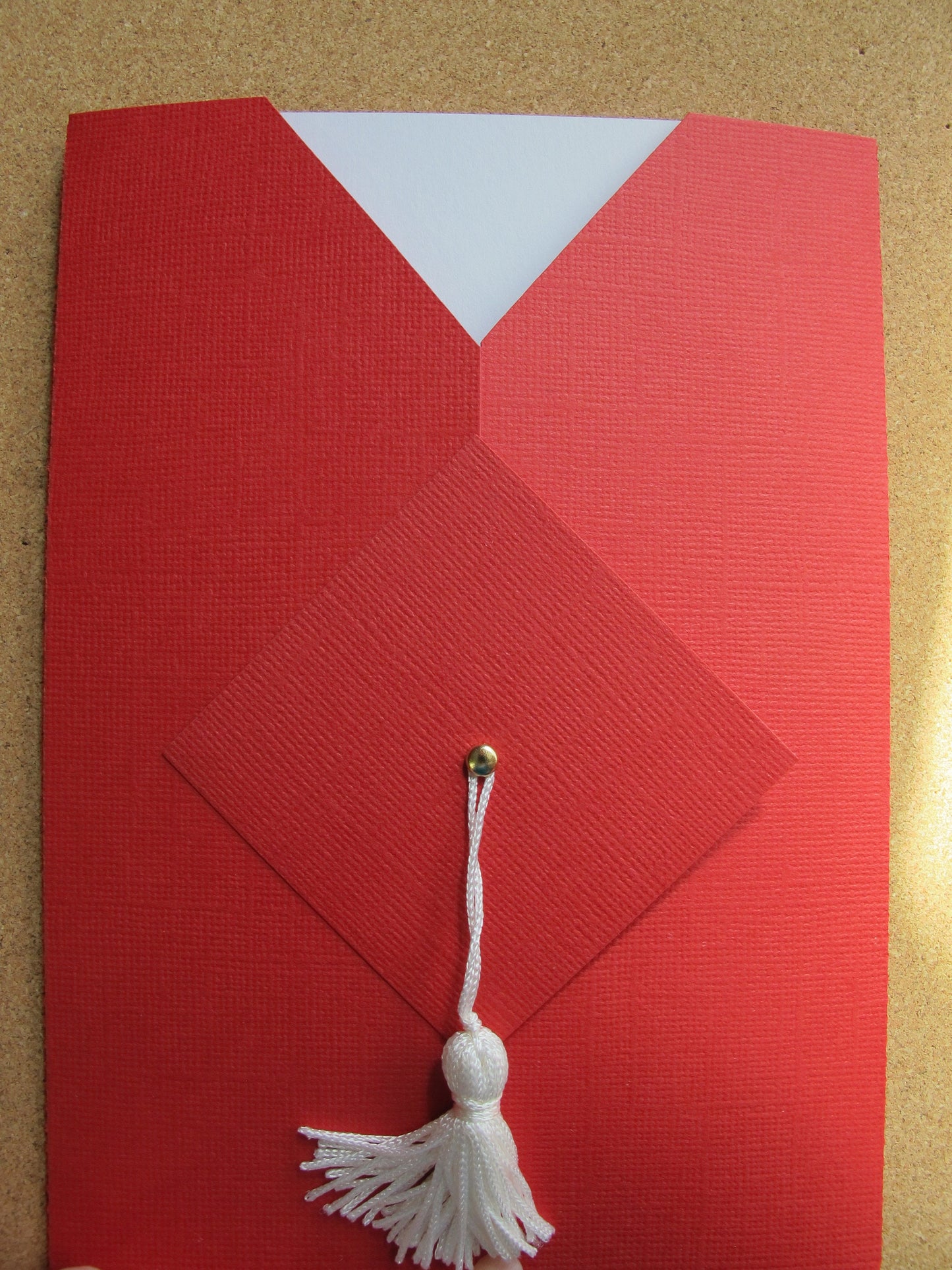 graduation invitation in the shop of cap and gown