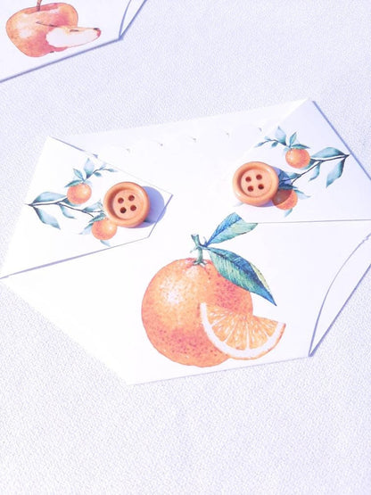 diaper shaped gift card holder with an orange design and buttons